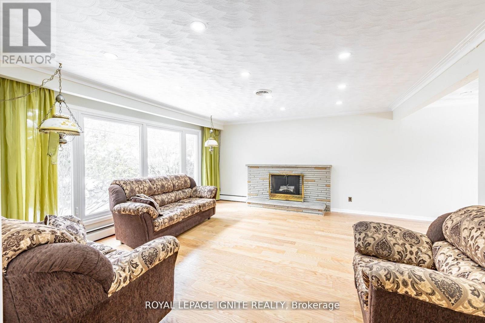 Main - 83 Deep Dene Drive, Toronto, ON - Indoor Photo Showing Living Room With Fireplace