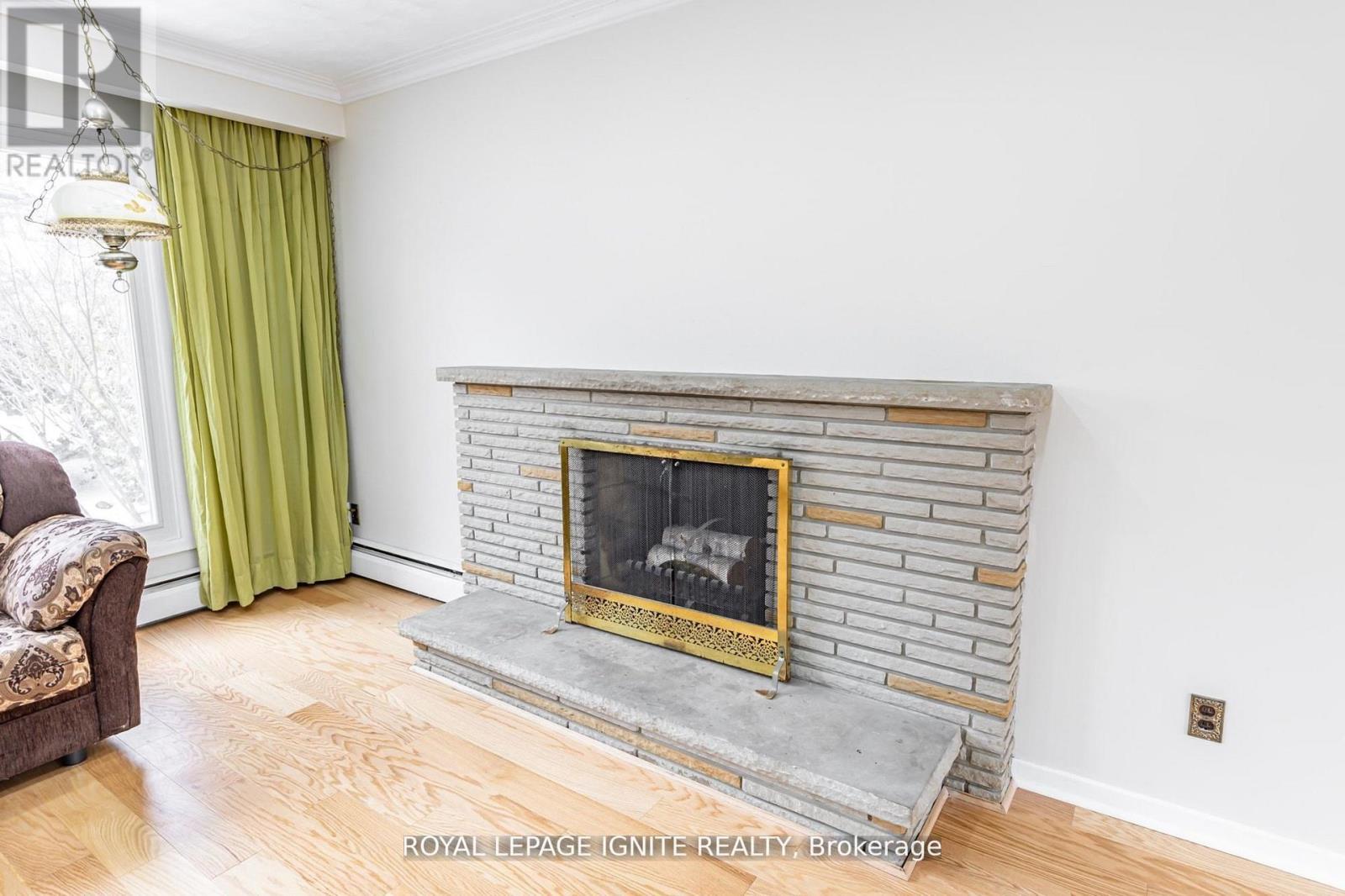 Main - 83 Deep Dene Drive, Toronto, ON - Indoor Photo Showing Living Room With Fireplace