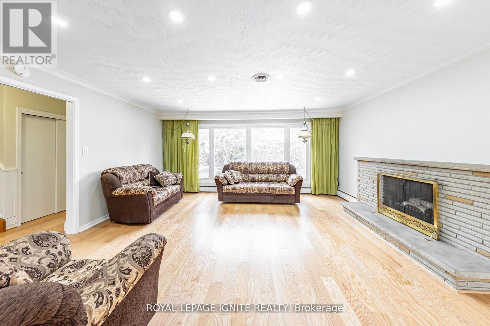 Main - 83 Deep Dene Drive, Toronto, ON - Indoor Photo Showing Living Room With Fireplace