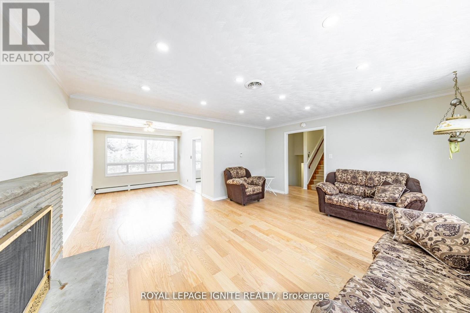 Main - 83 Deep Dene Drive, Toronto, ON - Indoor Photo Showing Living Room With Fireplace