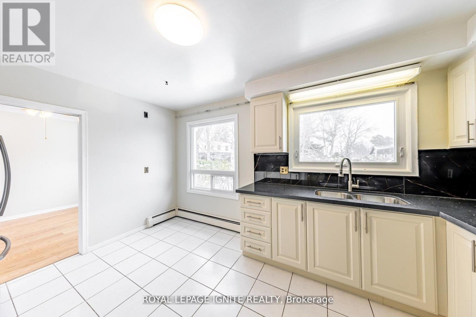 Main - 83 Deep Dene Drive, Toronto, ON - Indoor Photo Showing Kitchen With Double Sink
