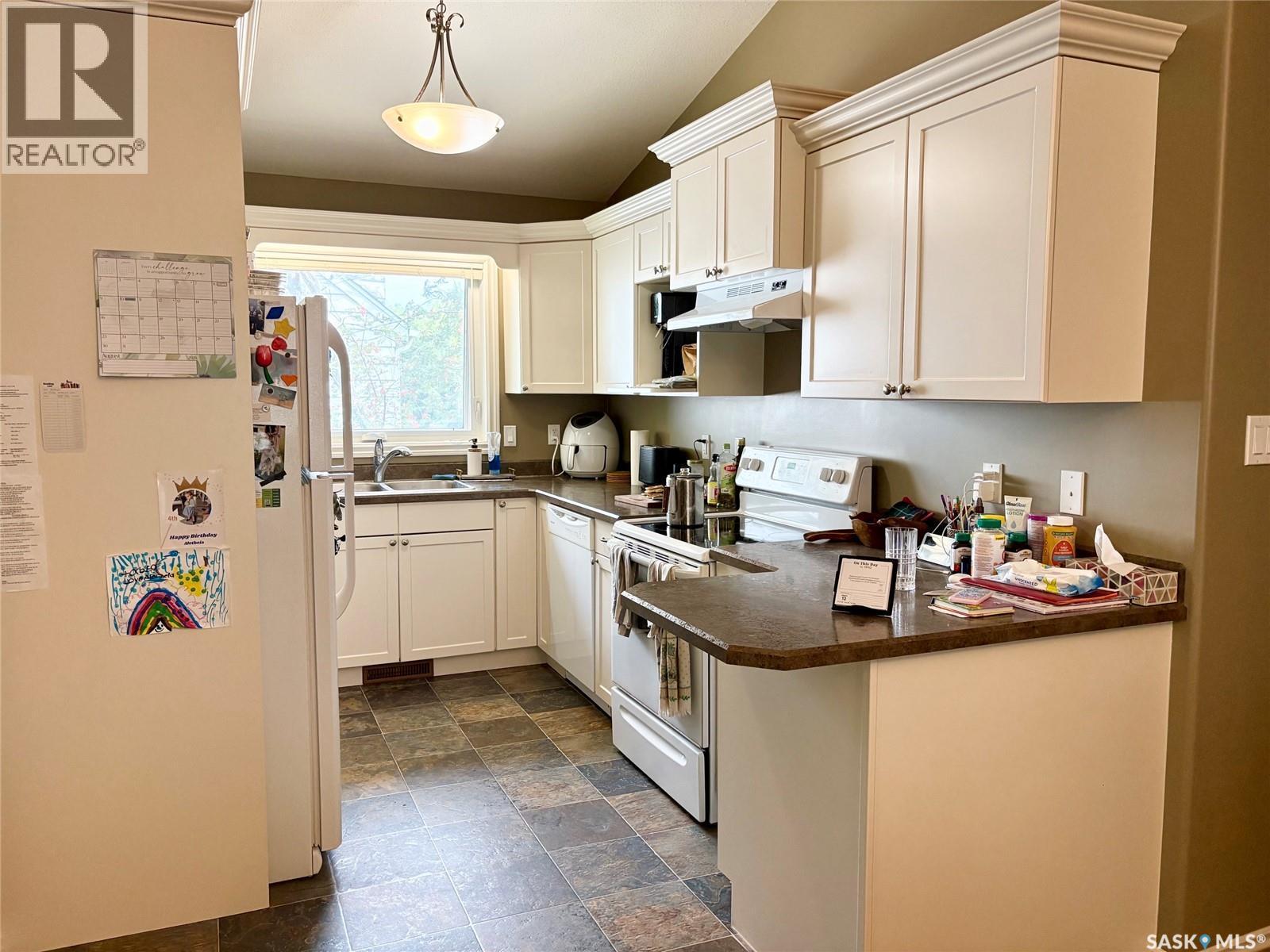 75 Agricultural Avenue, Yorkton, SK - Indoor Photo Showing Kitchen With Double Sink