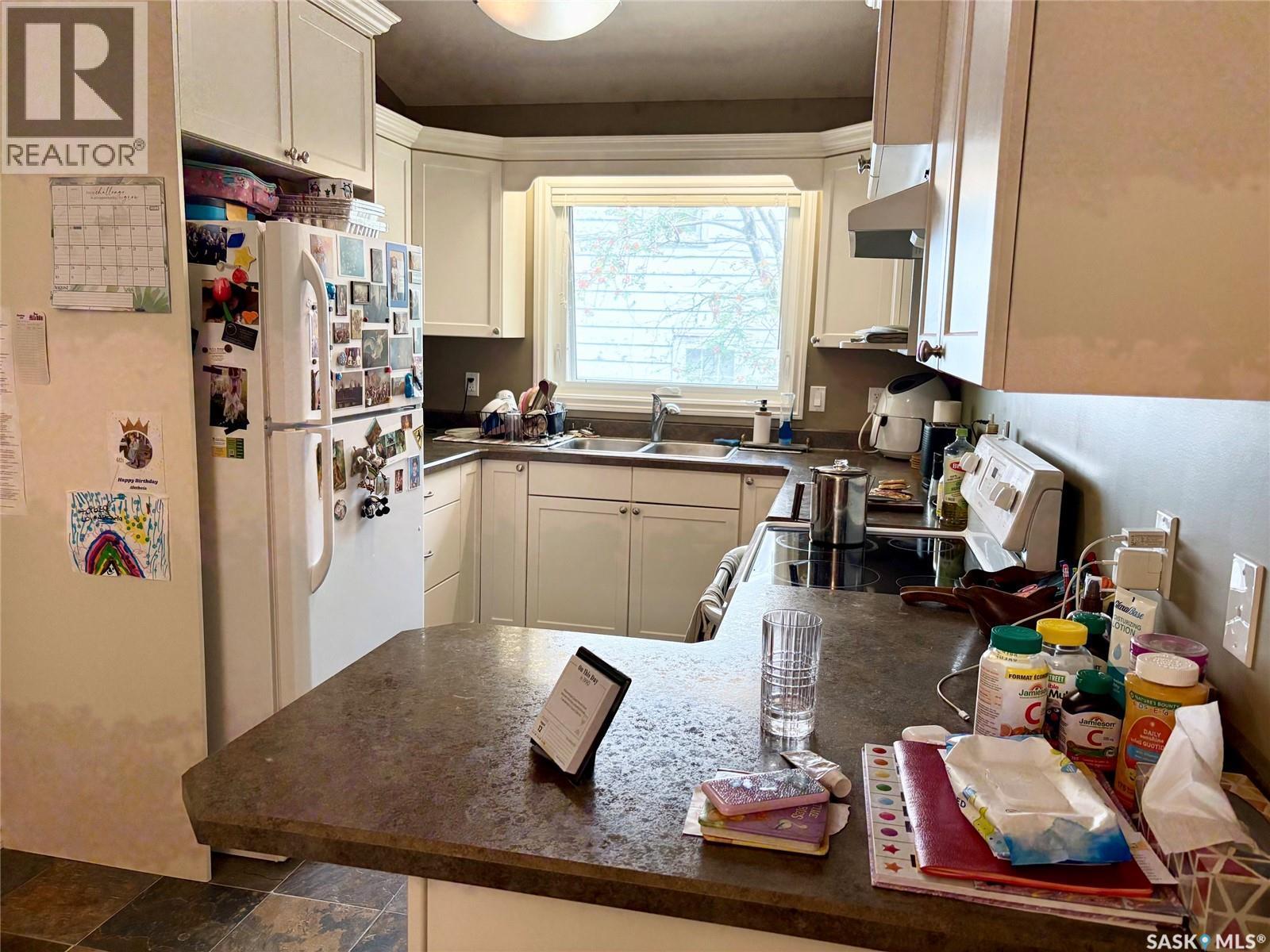 75 Agricultural Avenue, Yorkton, SK - Indoor Photo Showing Kitchen With Double Sink