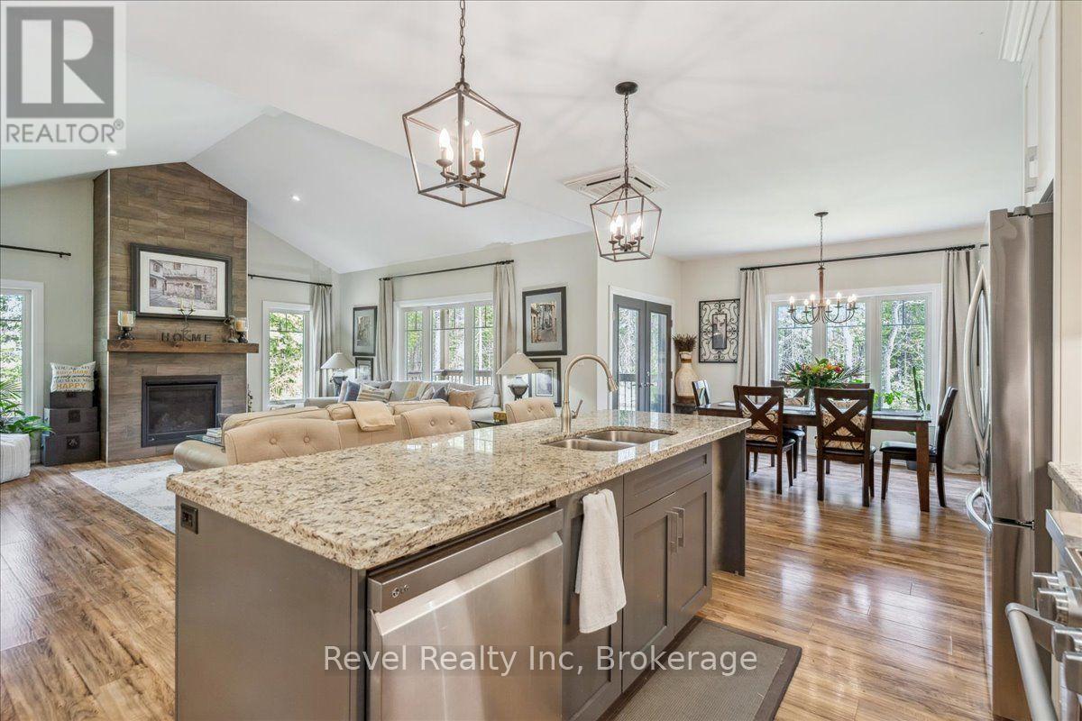 59 Trout Lane, Tiny, ON - Indoor Photo Showing Kitchen With Fireplace With Double Sink