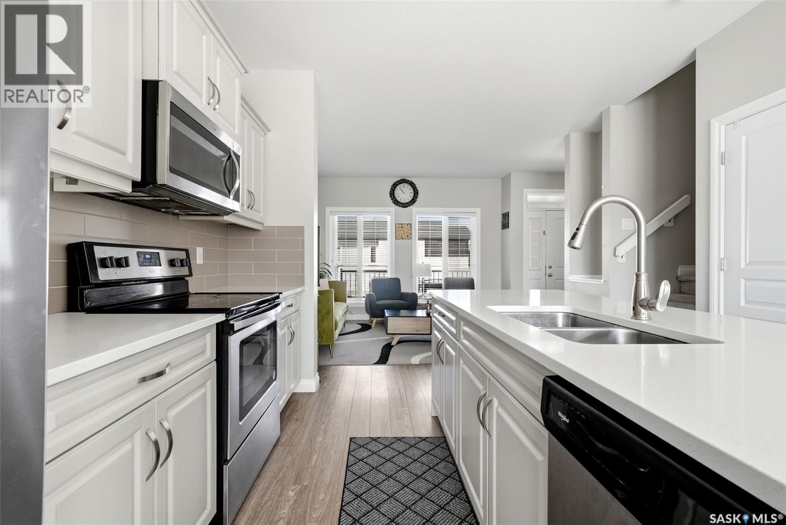 3409 Green Jade Lane, Regina, SK - Indoor Photo Showing Kitchen With Stainless Steel Kitchen With Double Sink With Upgraded Kitchen
