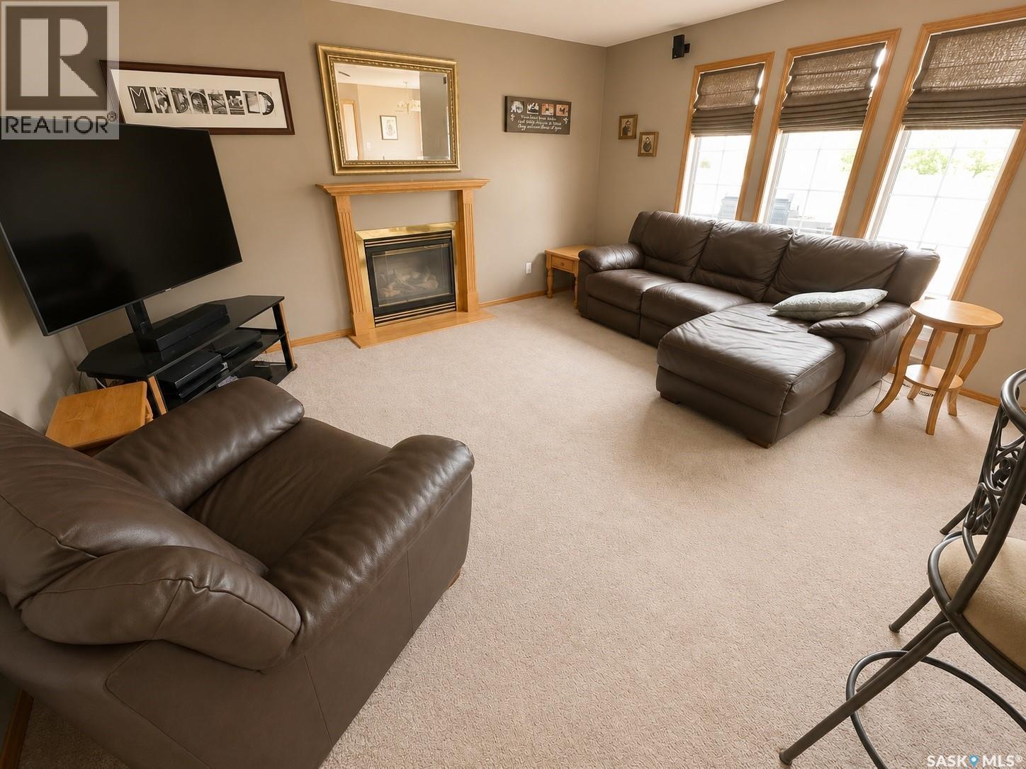 Mcdonald Acreage, Weyburn Rm No. 67, SK - Indoor Photo Showing Living Room With Fireplace