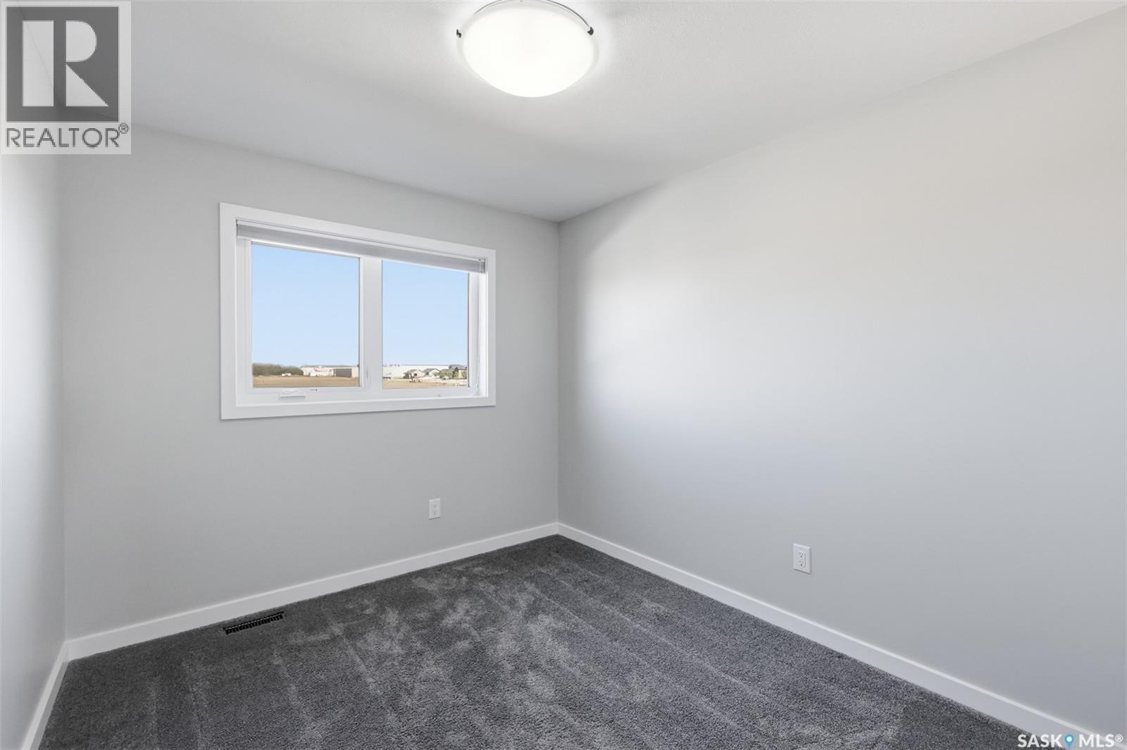 812 1St Avenue N, Warman, SK - Indoor Photo Showing Other Room