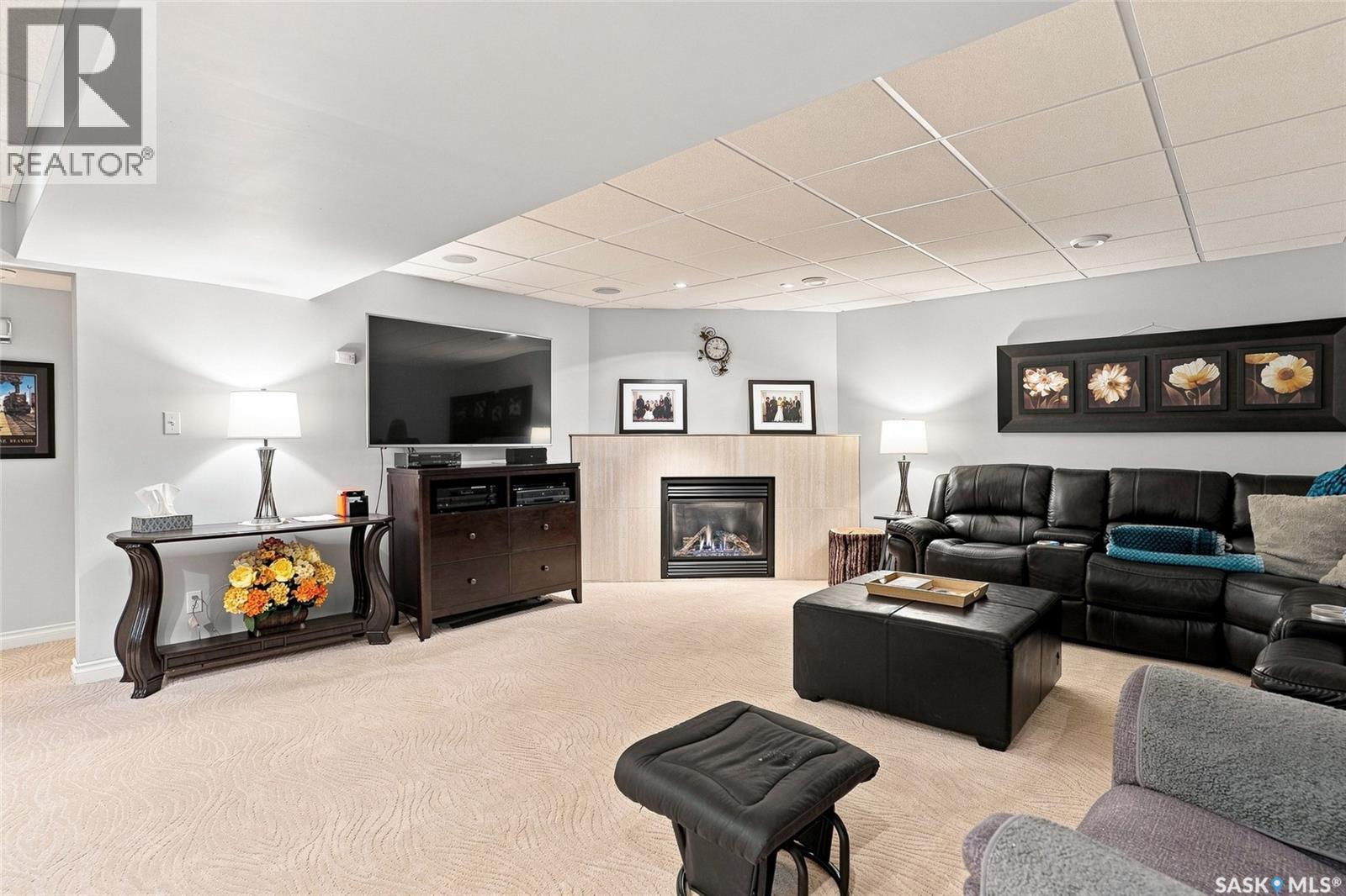 223 Egnatoff Crescent, Saskatoon, SK - Indoor Photo Showing Living Room With Fireplace