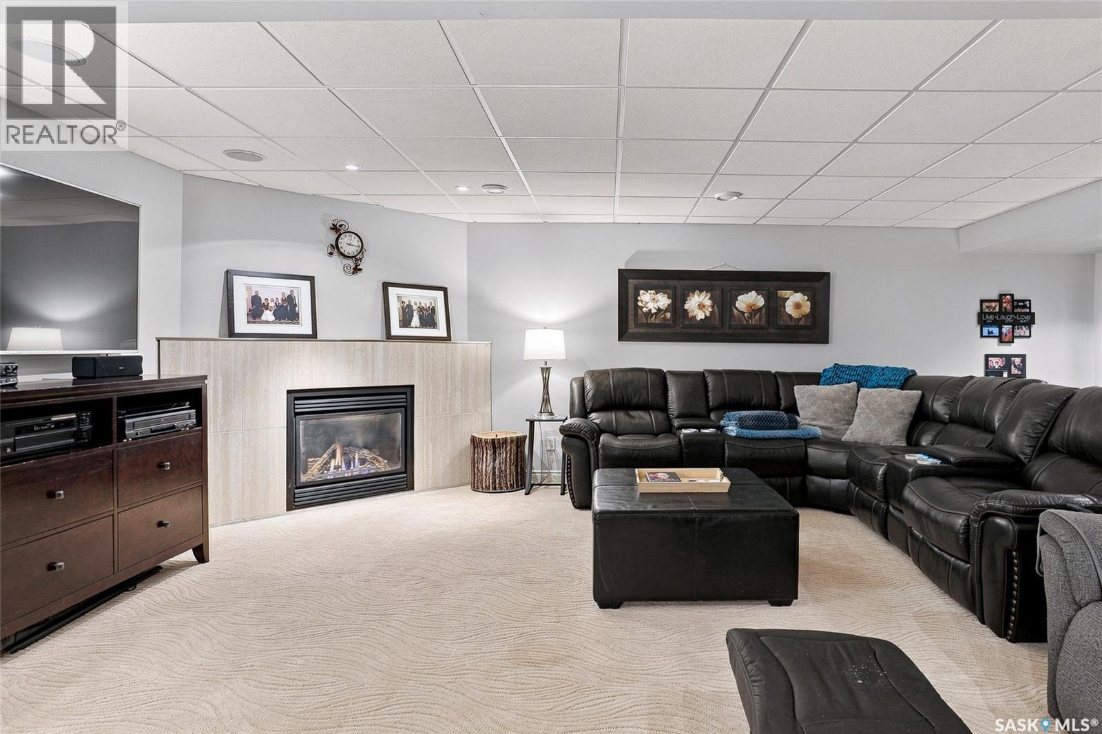 223 Egnatoff Crescent, Saskatoon, SK - Indoor Photo Showing Living Room With Fireplace