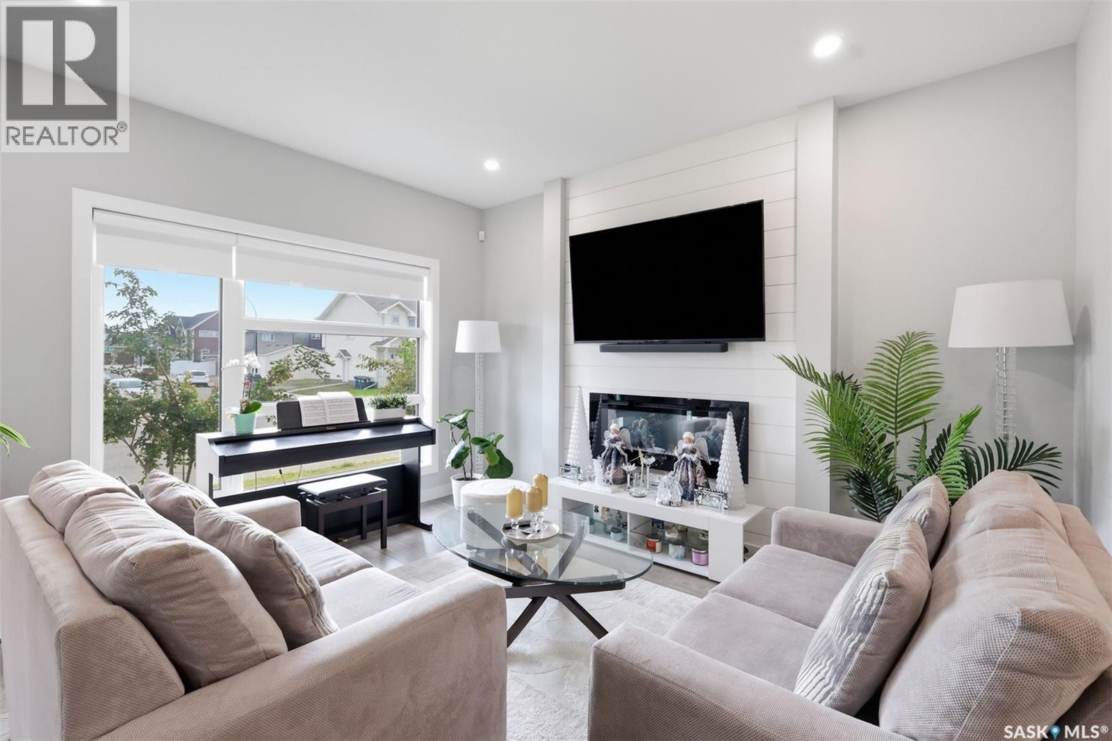 258 Brighton Boulevard, Saskatoon, SK - Indoor Photo Showing Living Room With Fireplace