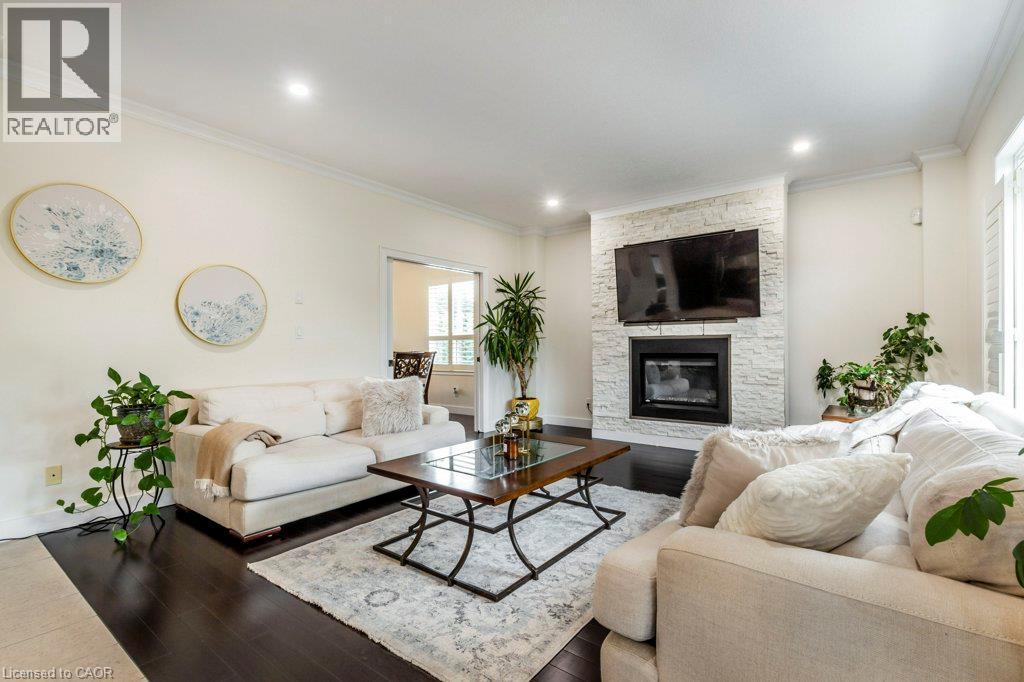 14 Anastasia Drive, Kitchener, ON - Indoor Photo Showing Living Room With Fireplace
