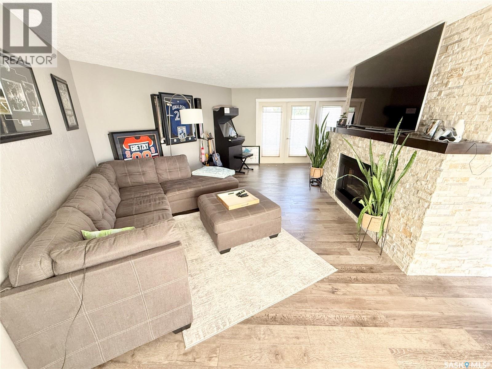 3 Mclelland Bay, Weyburn, SK - Indoor Photo Showing Living Room With Fireplace