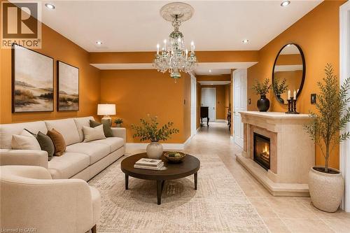 Virtually Staged - 218 Macaulay Street E, Hamilton, ON - Indoor Photo Showing Living Room With Fireplace