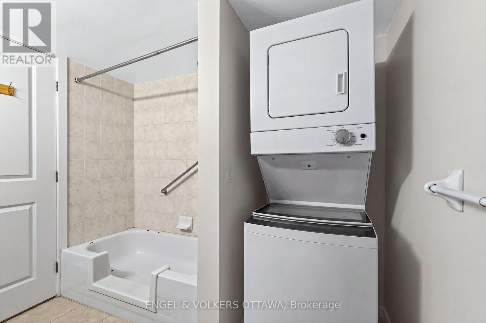 This image has been virtually staged. - 604 - 138 Somerset Street W, Ottawa, ON - Indoor Photo Showing Laundry Room