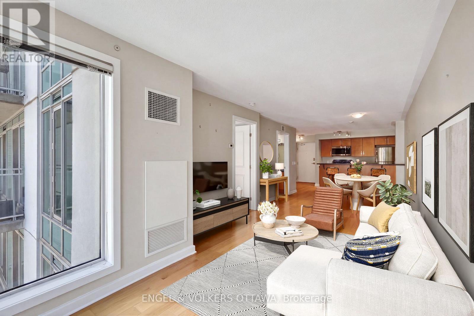 This image has been virtually staged. - 604 - 138 Somerset Street W, Ottawa, ON - Indoor Photo Showing Living Room