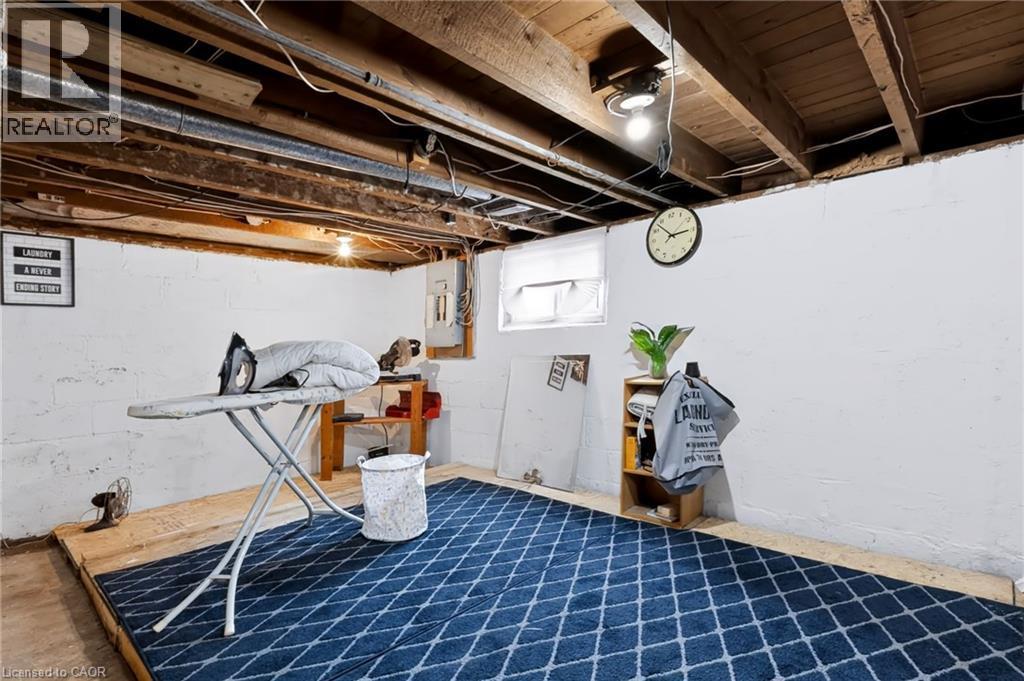 Flexible space that can be used as a laundry or hobby room area - 703 Brighton Avenue, Hamilton, ON - Indoor Photo Showing Basement