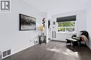 Hardwood-style flooring with a natural light exposure - 703 Brighton Avenue, Hamilton, ON 