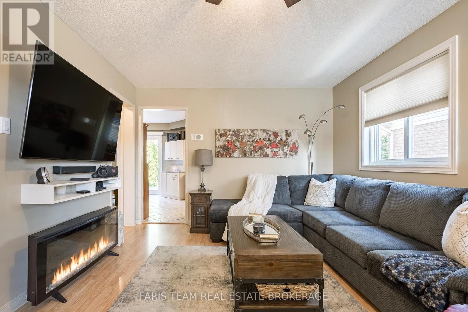 4 Bluegrass Drive, Barrie, ON - Indoor Photo Showing Living Room With Fireplace