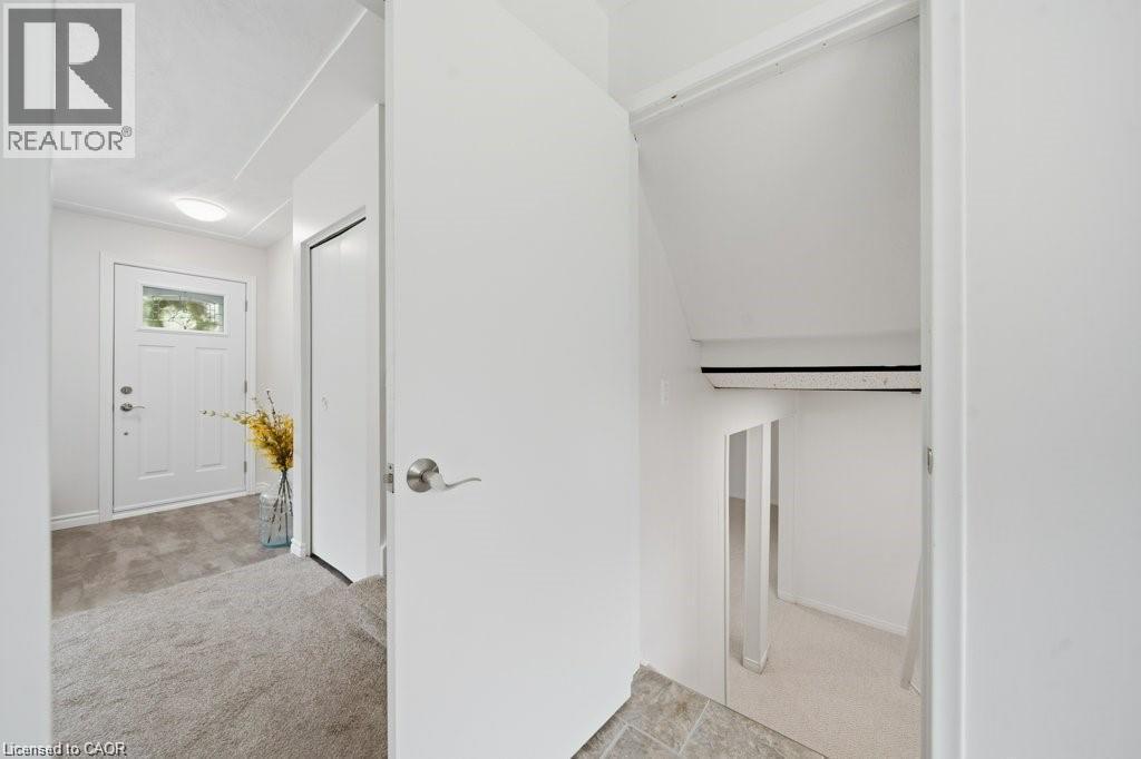 Stairs down to rec room, laundry and 2nd bathroom - 64 Warren Road, Kitchener, ON - Indoor Photo Showing Other Room