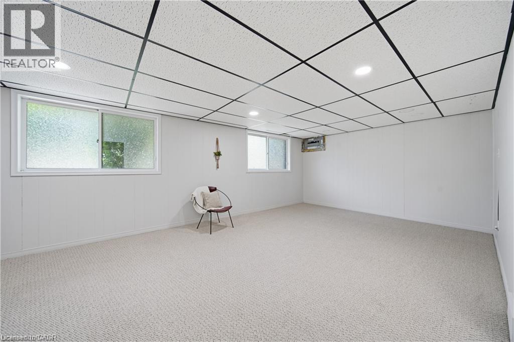 Recessed lighting, drop ceiling, and light-colored carpet flooring - 64 Warren Road, Kitchener, ON - Indoor Photo Showing Other Room