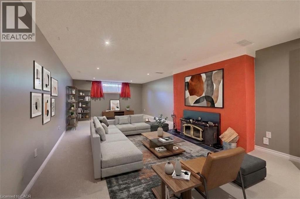 Recessed lighting illuminates the space - 251 Union Street E, Waterloo, ON - Indoor Photo Showing Living Room With Fireplace