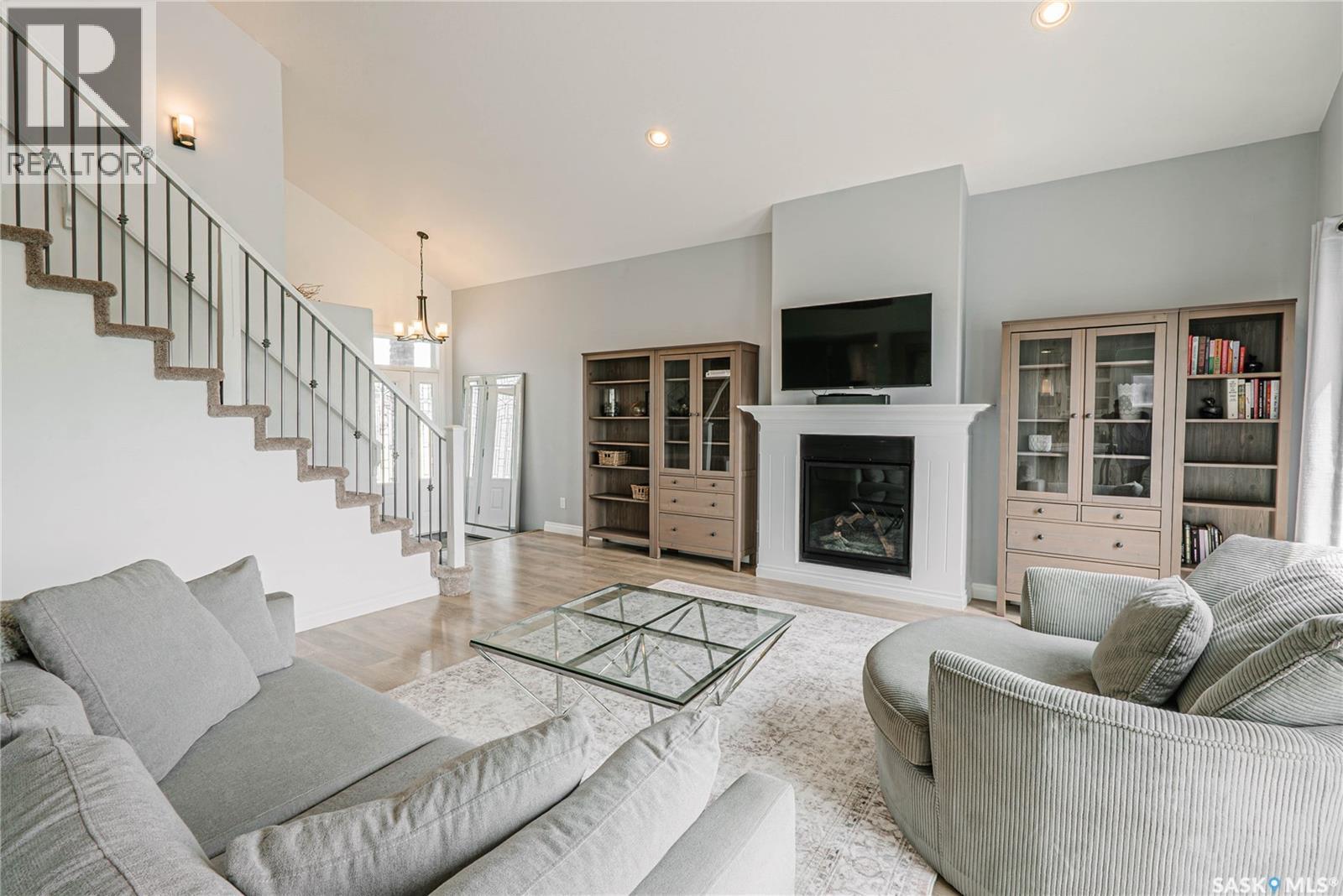 400 Stone Terrace, Martensville, SK - Indoor Photo Showing Living Room With Fireplace