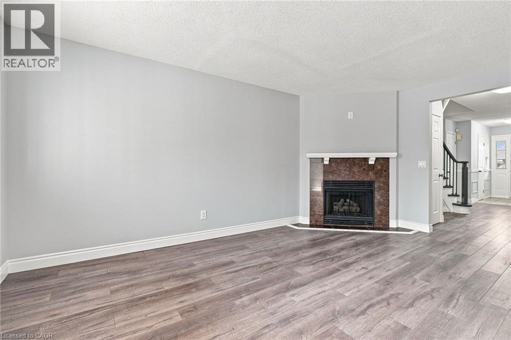 1 Perthshire Court, Hamilton, ON - Indoor Photo Showing Living Room With Fireplace