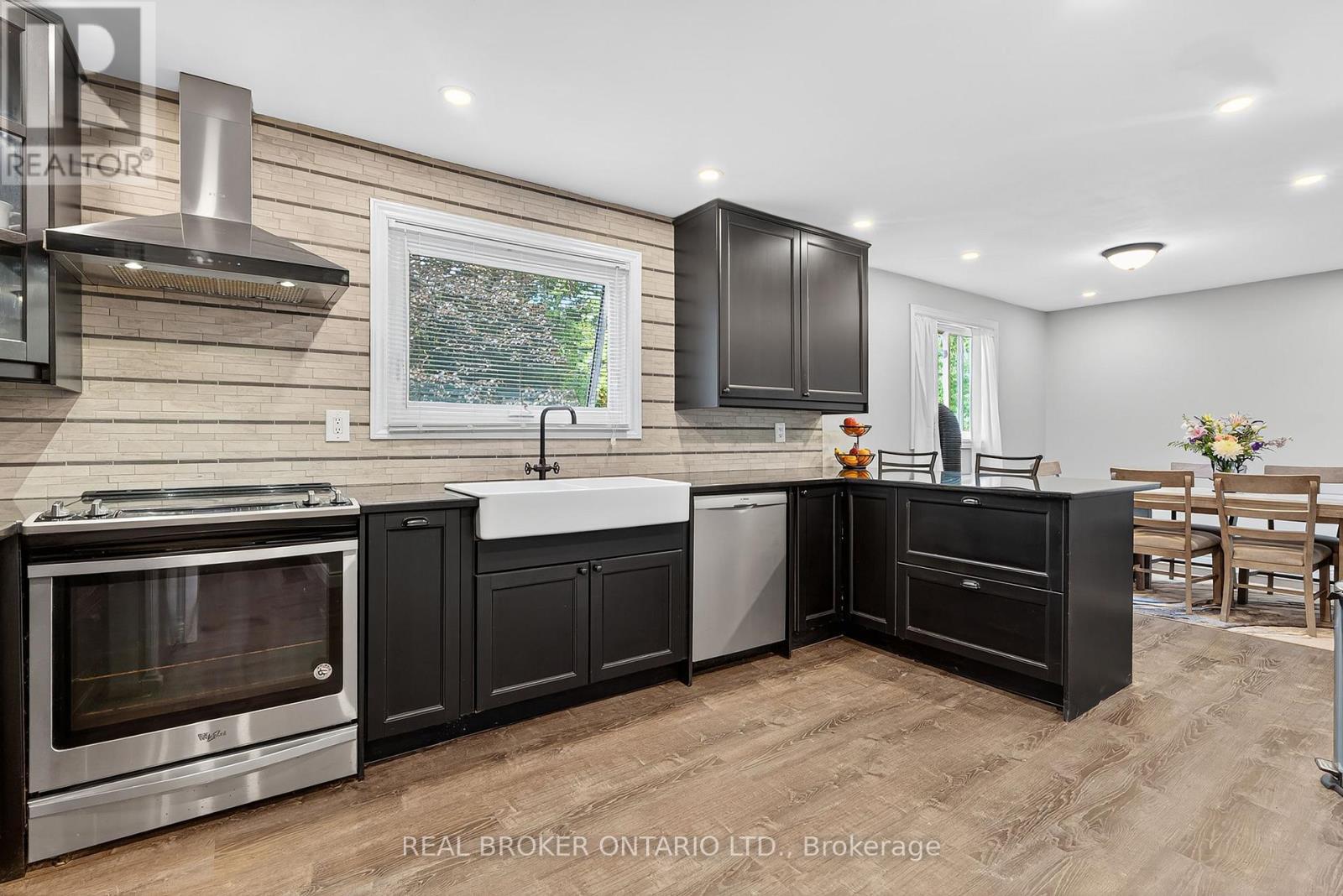 Modern kitchen featuring dark wood-finish cabinets - 312 Old Guelph Road, Hamilton, ON