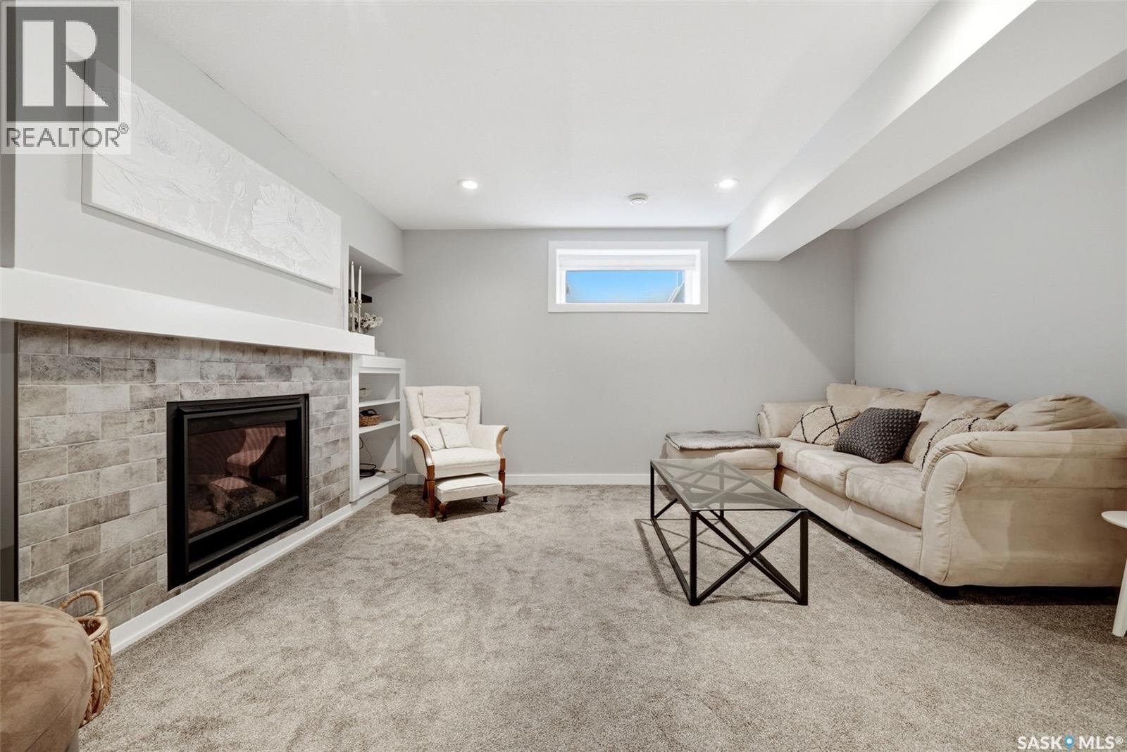 5565 Norseman Crescent, Regina, SK - Indoor Photo Showing Basement With Fireplace