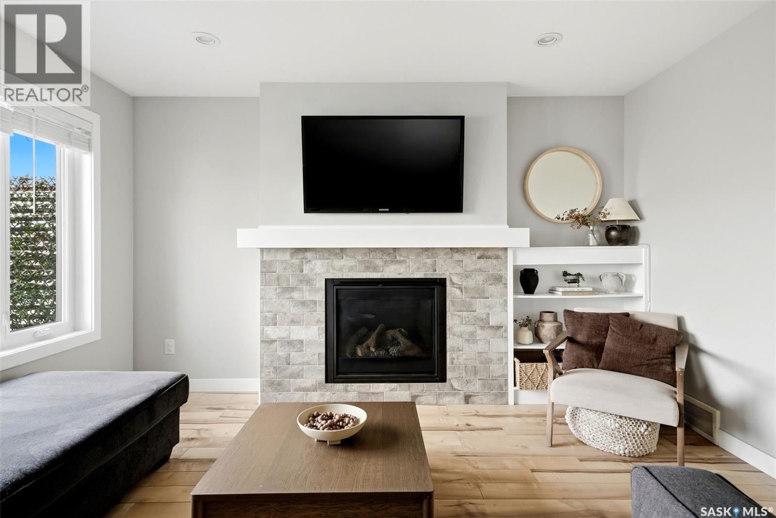 5565 Norseman Crescent, Regina, SK - Indoor Photo Showing Living Room With Fireplace