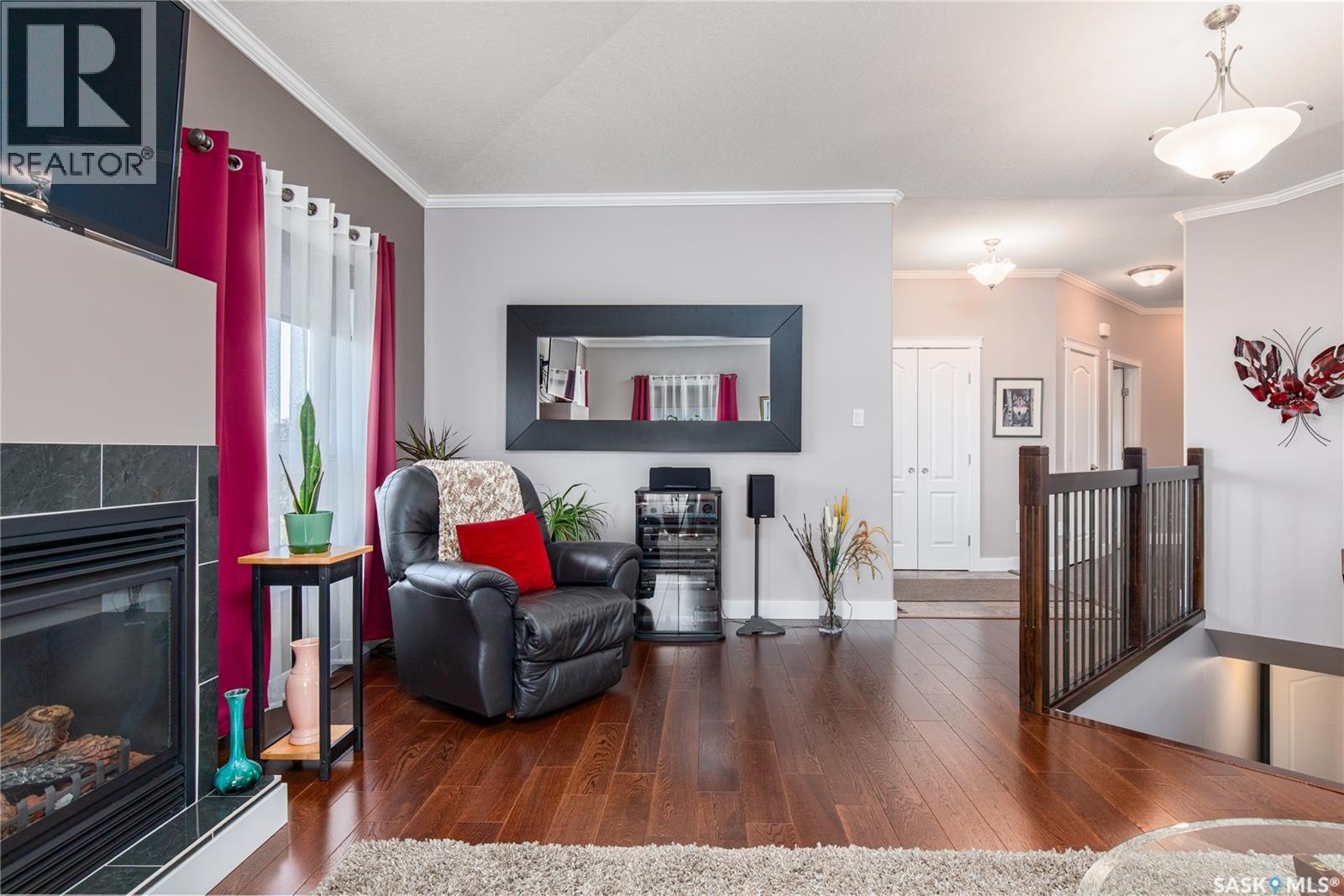 111 Iron Bridge Drive, Moose Jaw, SK - Indoor Photo Showing Living Room With Fireplace