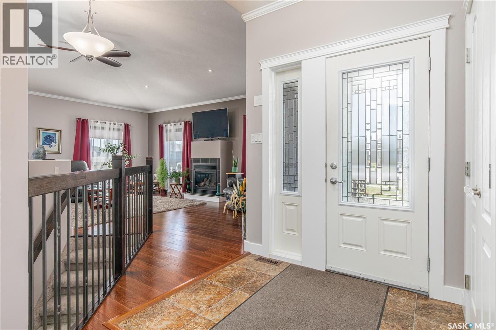 111 Iron Bridge Drive, Moose Jaw, SK - Indoor Photo Showing Other Room With Fireplace