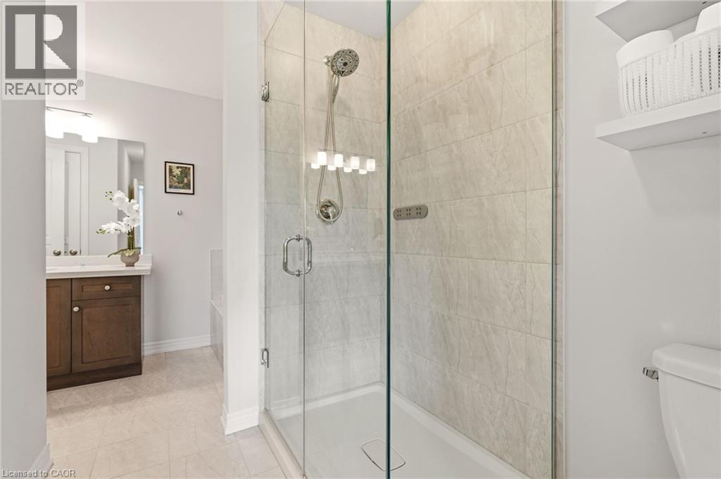 Glass-enclosed shower with a tiled surround - 4171 Palermo Common, Burlington, ON - Indoor Photo Showing Bathroom
