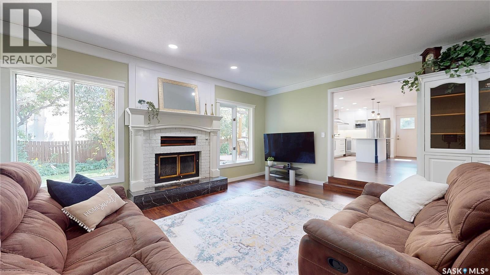 2210 Hanover Crescent E, Regina, SK - Indoor Photo Showing Living Room With Fireplace