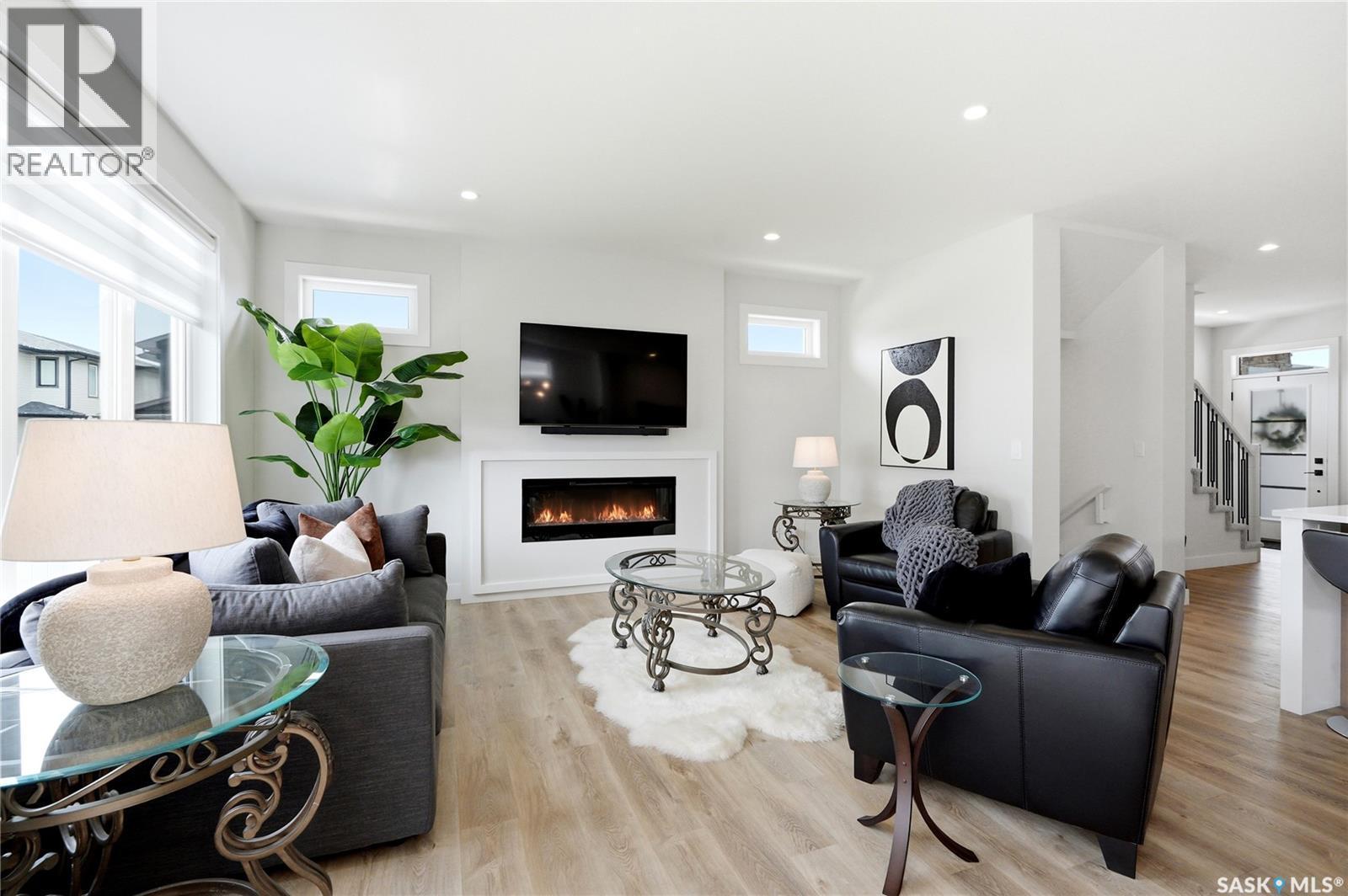 246 Prasad Manor, Saskatoon, SK - Indoor Photo Showing Living Room With Fireplace