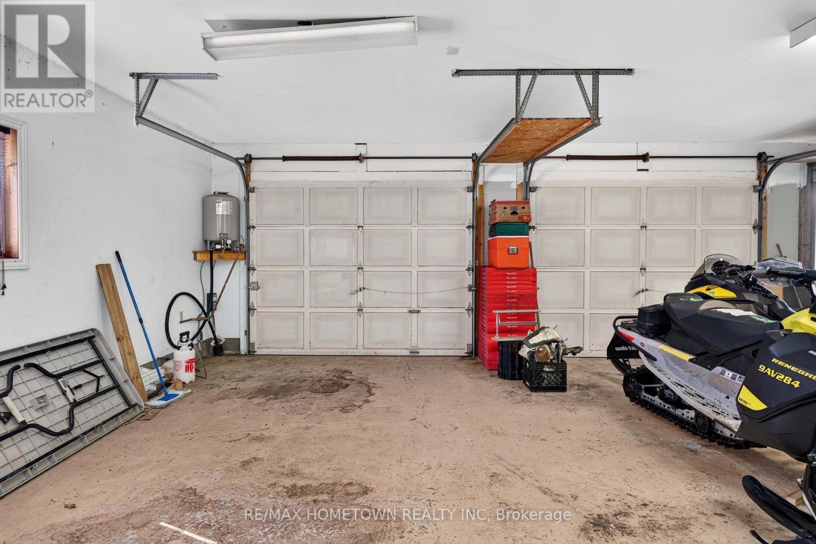 2 automatic doors with 2 manual garage doors - 116 Mill Creek Drive, Rideau Lakes, ON