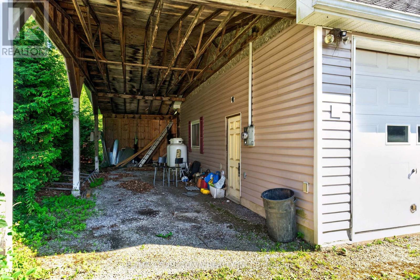 The Carport is 36.9' x 12' has RV hook up - 116 Mill Creek Drive, Rideau Lakes, ON