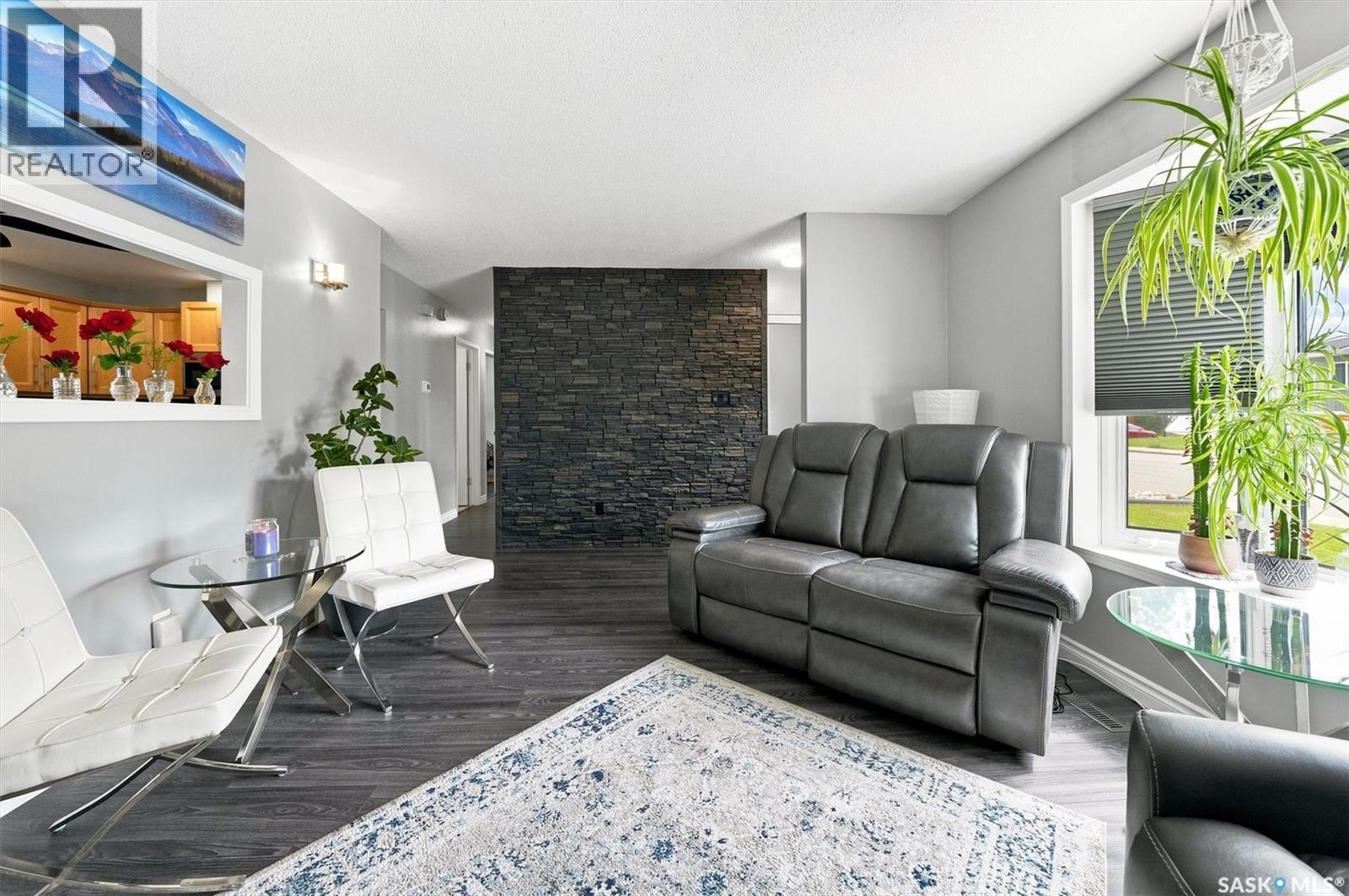 2010 37Th Street W, Saskatoon, SK - Indoor Photo Showing Living Room With Fireplace