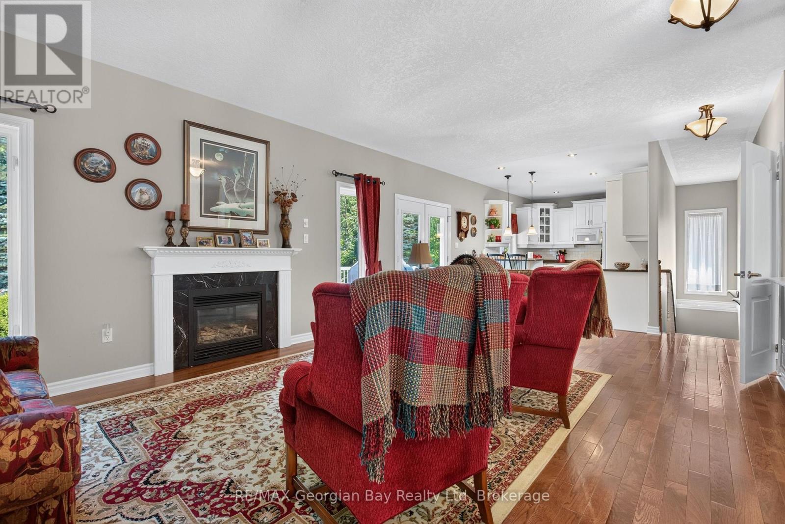 1339 Tiny Beaches Road N, Tiny, ON - Indoor Photo Showing Living Room With Fireplace