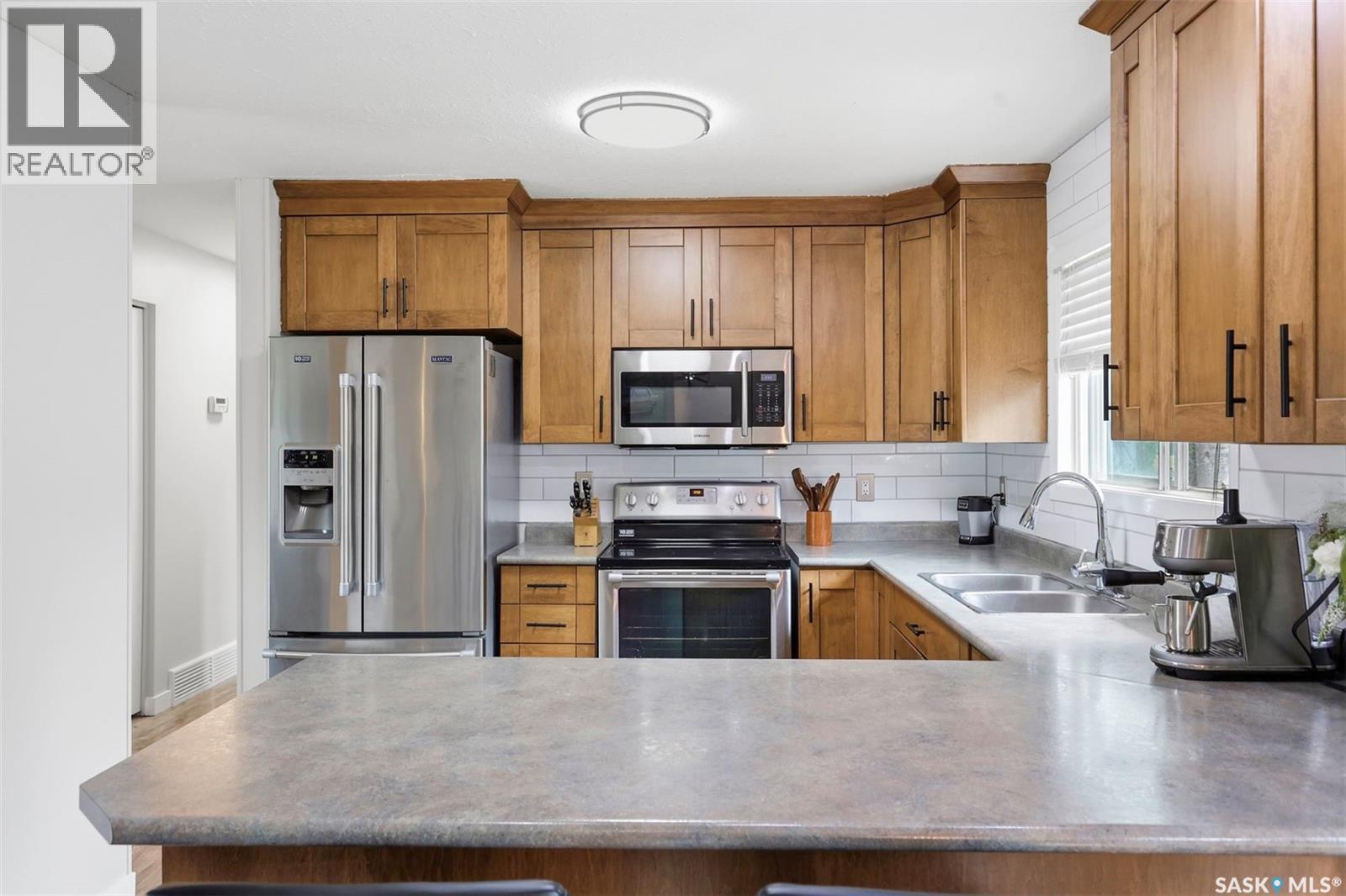 151 Makaroff Road, Saskatoon, SK - Indoor Photo Showing Kitchen With Stainless Steel Kitchen With Double Sink