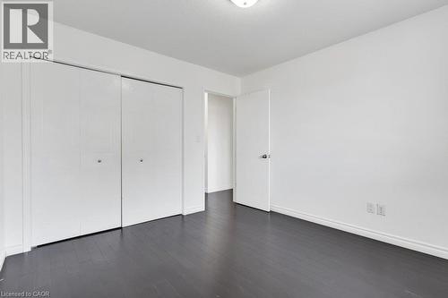 Dark wood-finish flooring - 76 Renner Drive, Cambridge, ON - Indoor Photo Showing Other Room