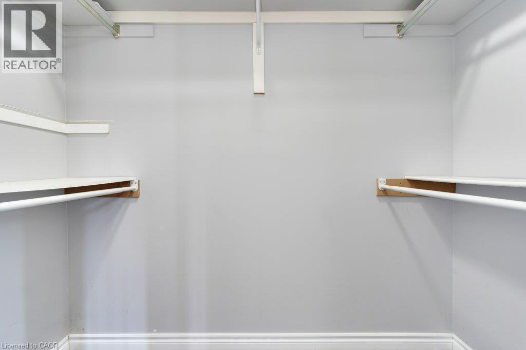 Built-in closet shelving and hanging rods - 76 Renner Drive, Cambridge, ON - Indoor With Storage