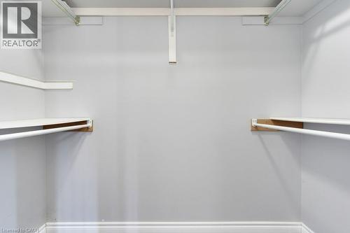 Built-in closet shelving and hanging rods - 76 Renner Drive, Cambridge, ON - Indoor With Storage