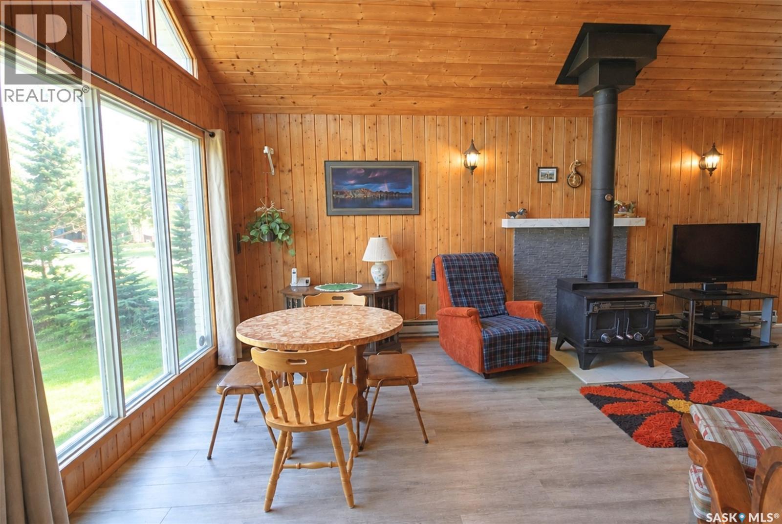 303 Christel Crescent, Lac Des Îles, SK - Indoor With Fireplace