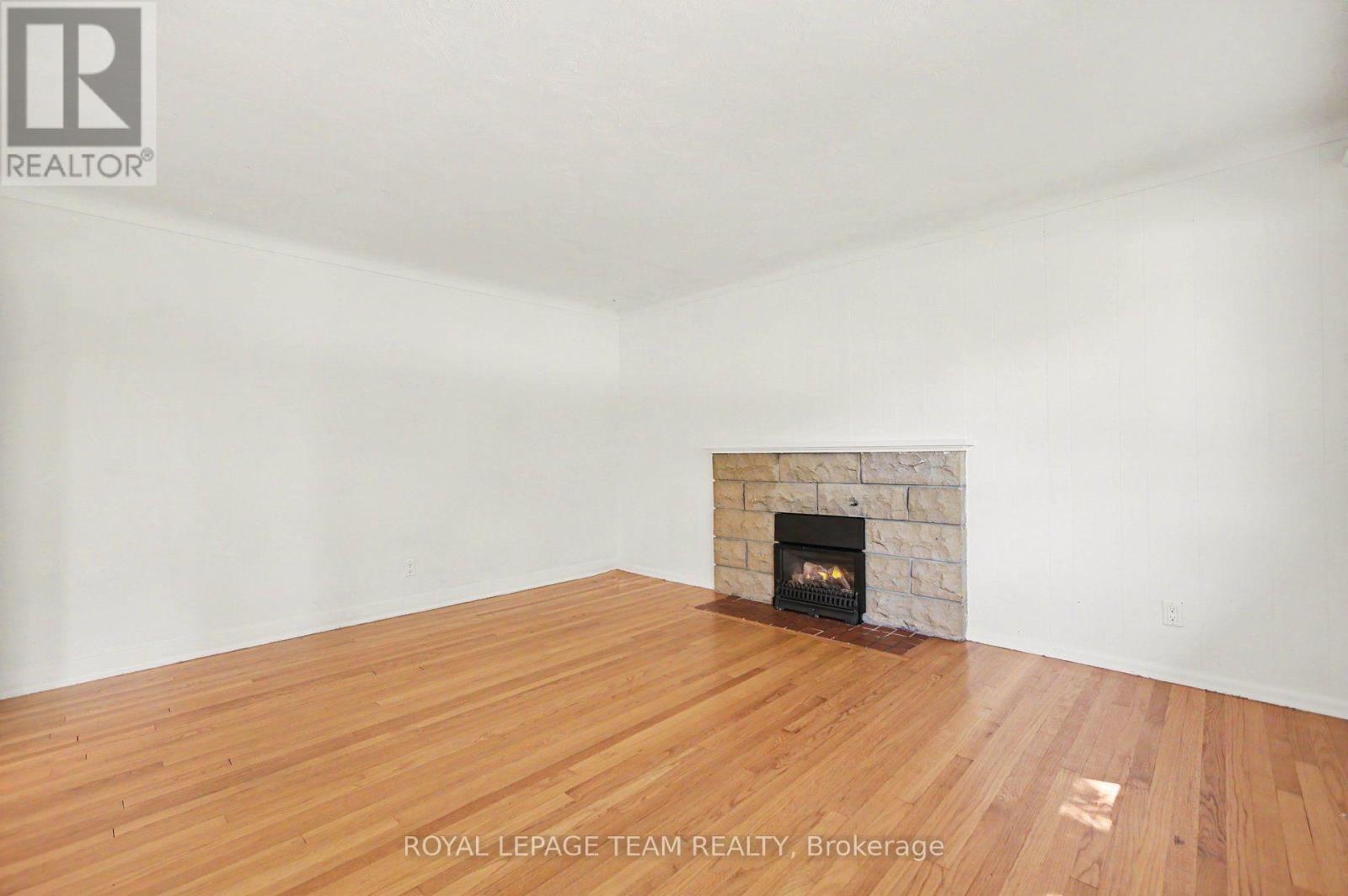 3 Donna Street, Ottawa, ON - Indoor Photo Showing Living Room With Fireplace
