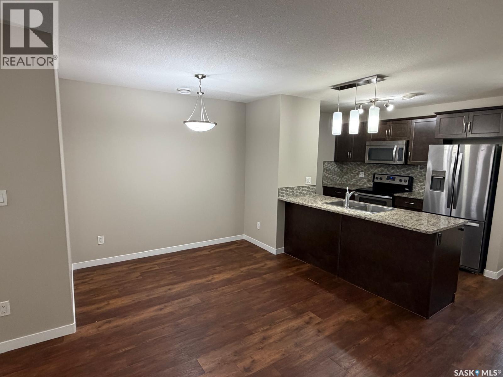 604 3440 Avonhurst Drive, Regina, SK - Indoor Photo Showing Kitchen With Double Sink