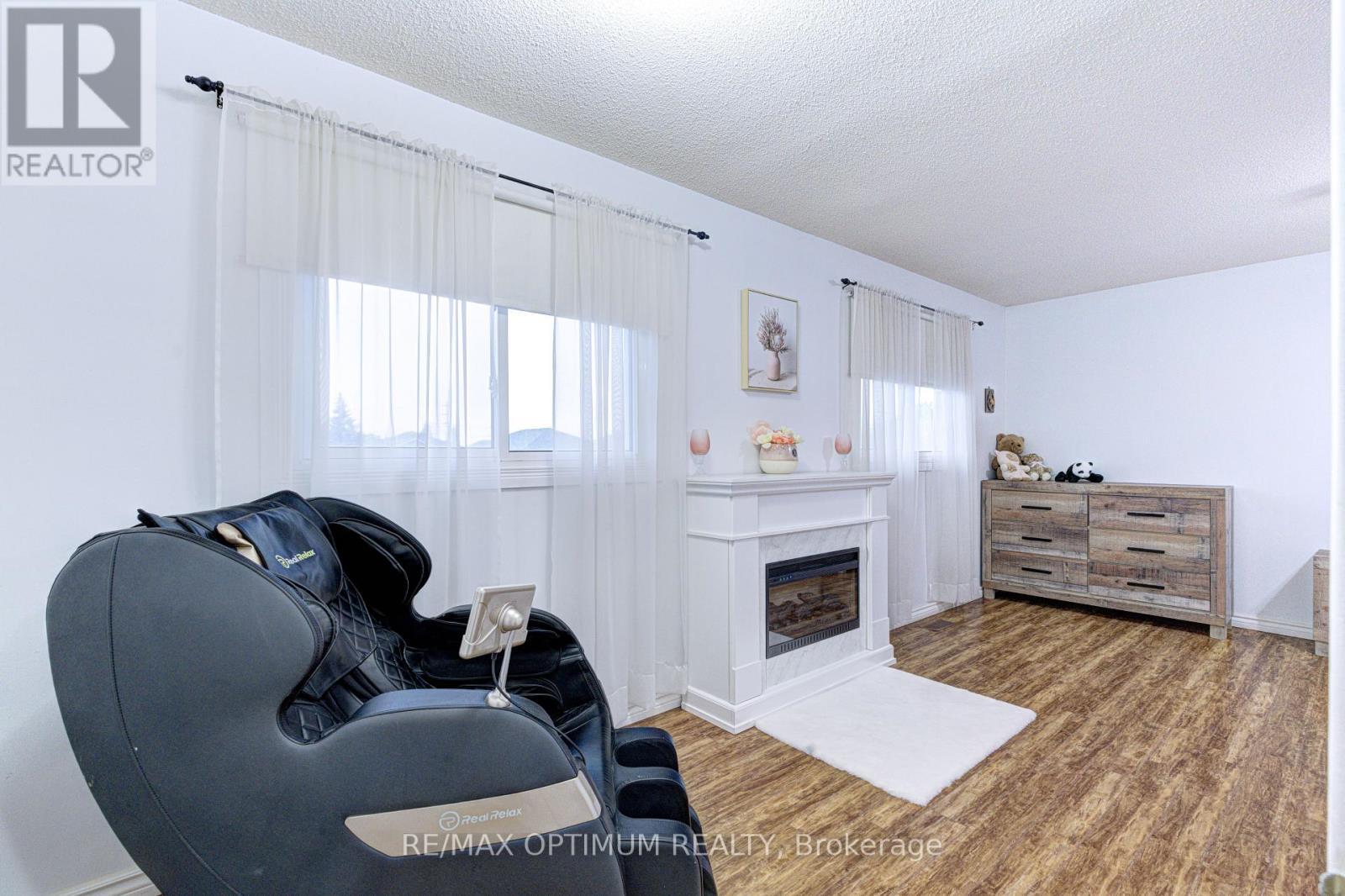 11 Murkar Crescent, Whitby, ON - Indoor With Fireplace