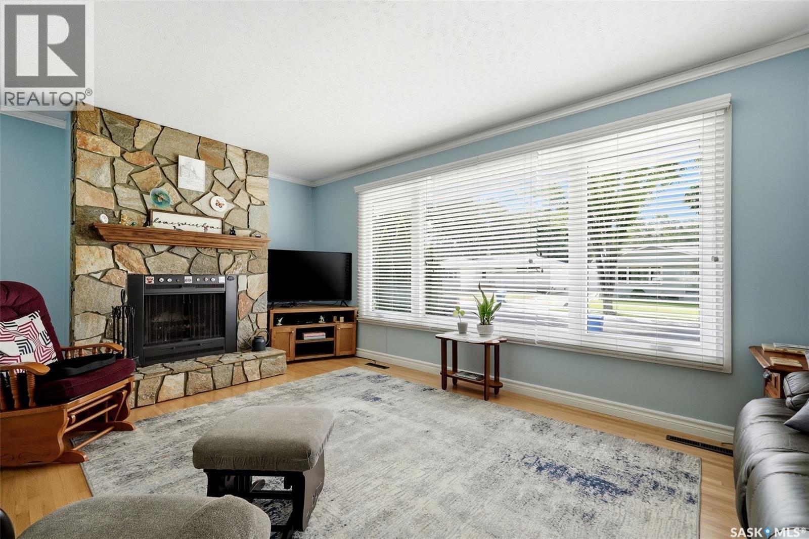 60 Gardiner Avenue, Regina, SK - Indoor Photo Showing Living Room With Fireplace
