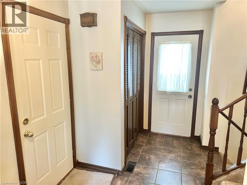 The other angle of the foyer - door leading out to the patio - 44 Douglas Avenue, Simcoe, ON - Indoor Photo Showing Other Room