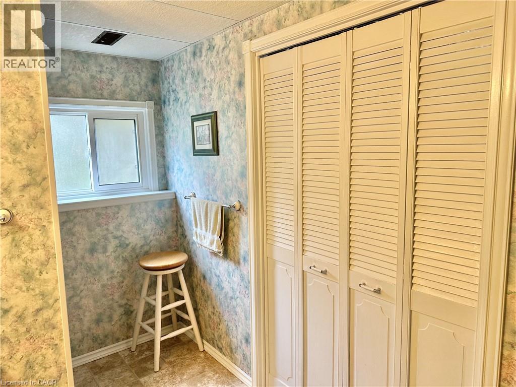 Lower Level Bathroom -walk in shower in corner and behind the doors is the laundry room - 44 Douglas Avenue, Simcoe, ON - Indoor Photo Showing Other Room